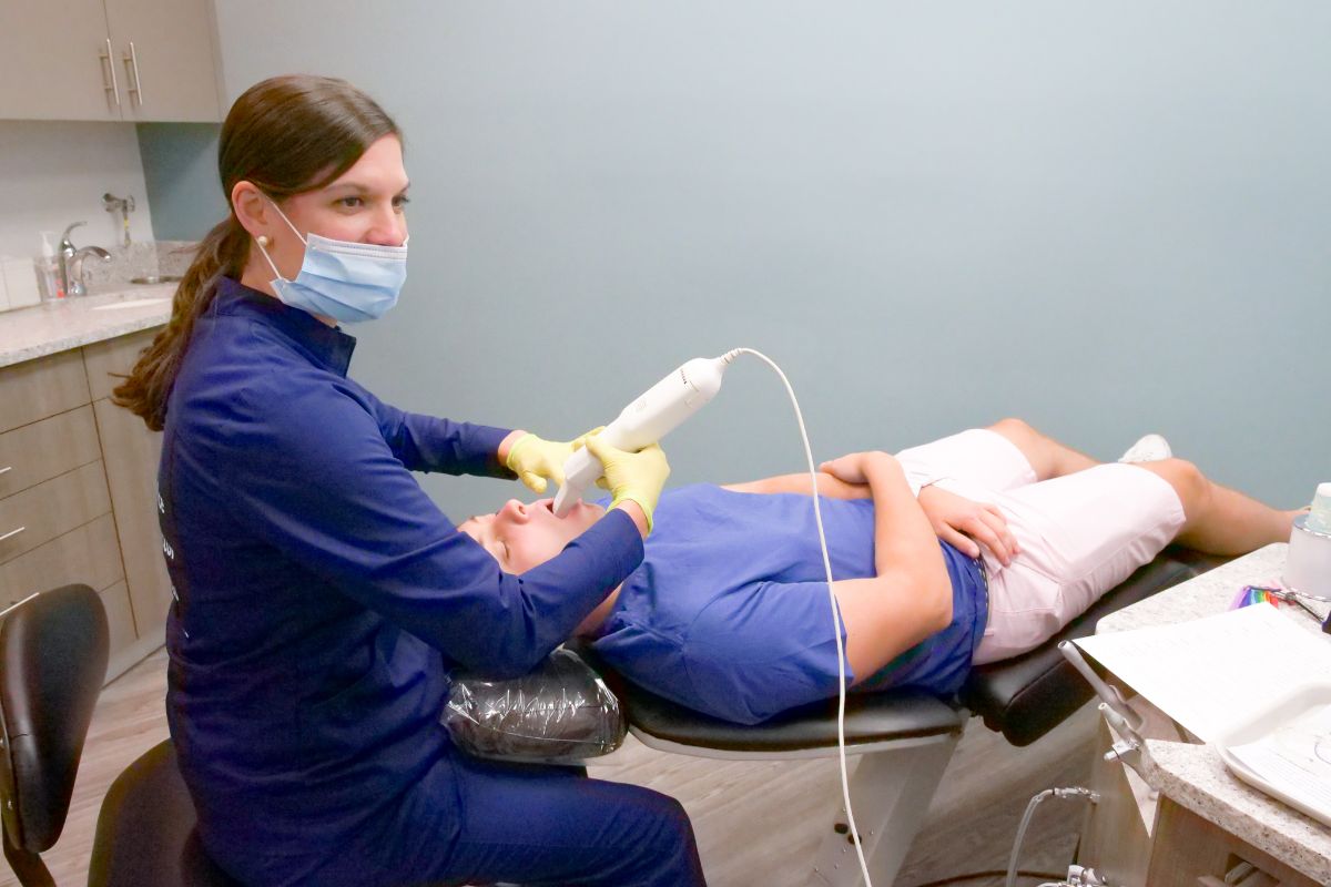 Ortho assistant scanning a patient's teeth